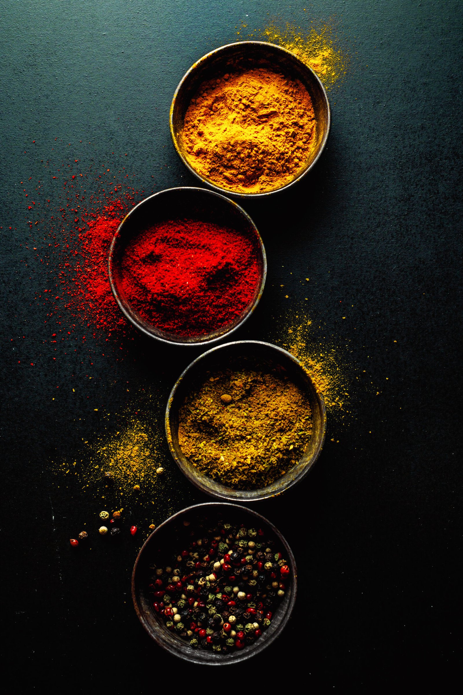 colorful spices on dark background